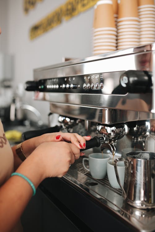 Free Woman Making Coffee in Cafe Stock Photo
