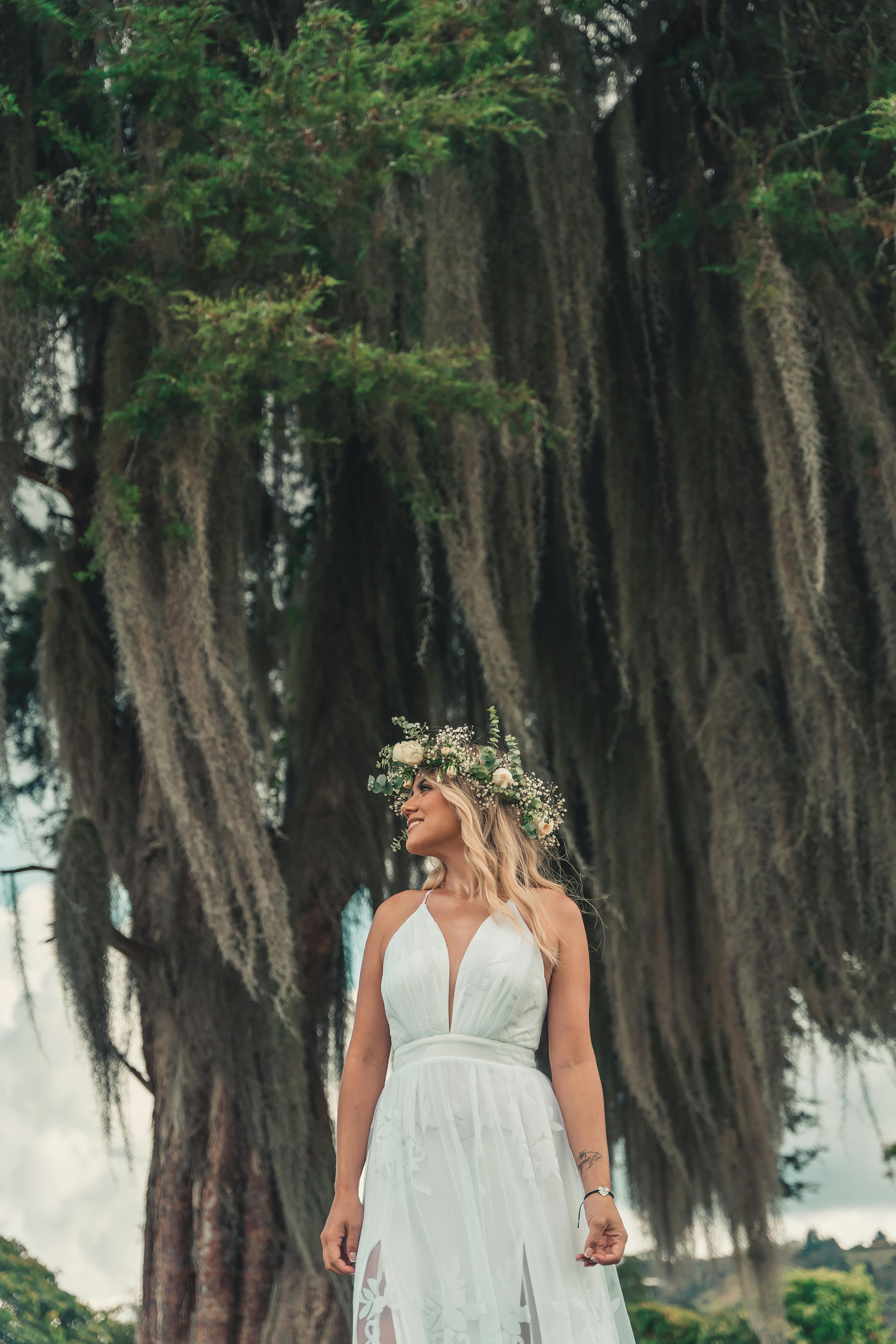 Portrait of Woman Wearing a Crown and Holding Bouquet of Flowers · Free  Stock Photo