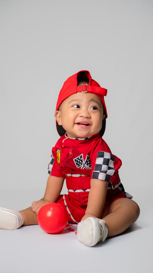 A Boy in Red Racing Suit