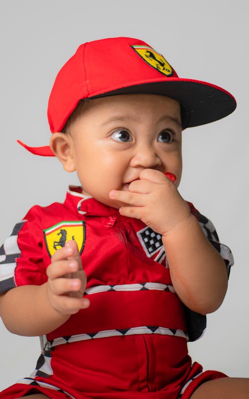 A Boy in Wearing Red Suit