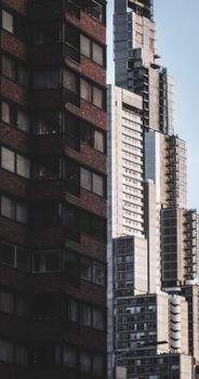 A striking vertical shot of towering skyscrapers in a bustling city center.