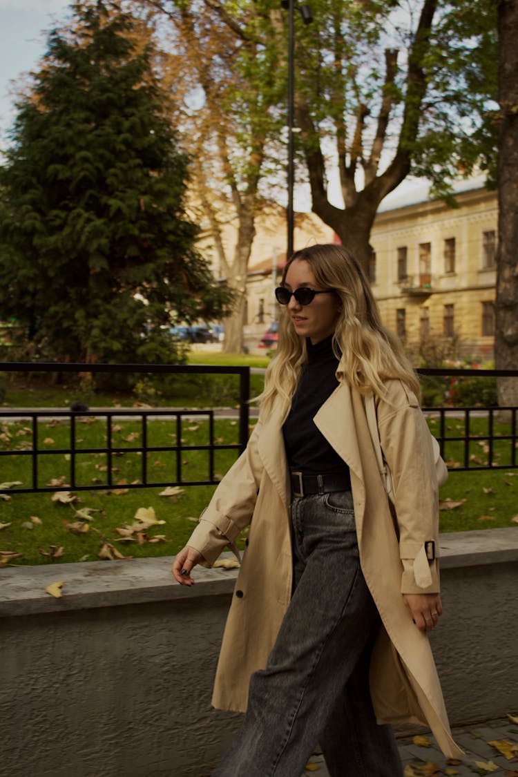 Young Fashionable Woman Walking In City 