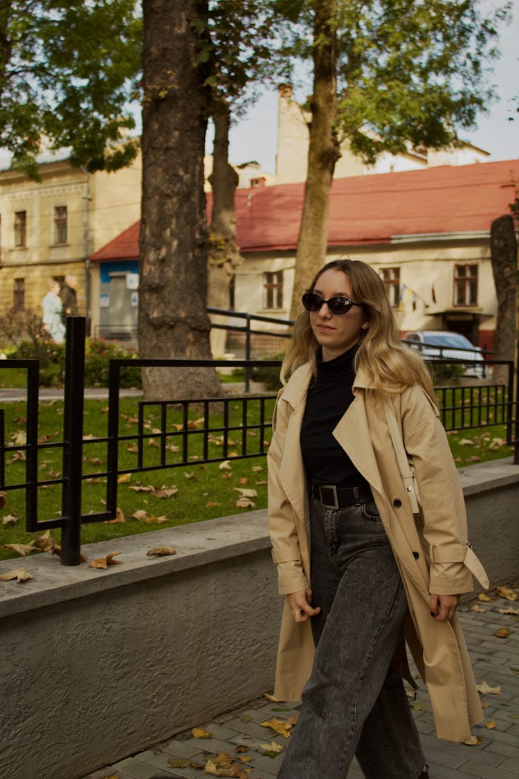 Woman In A Trench Coat And Sunglasses 