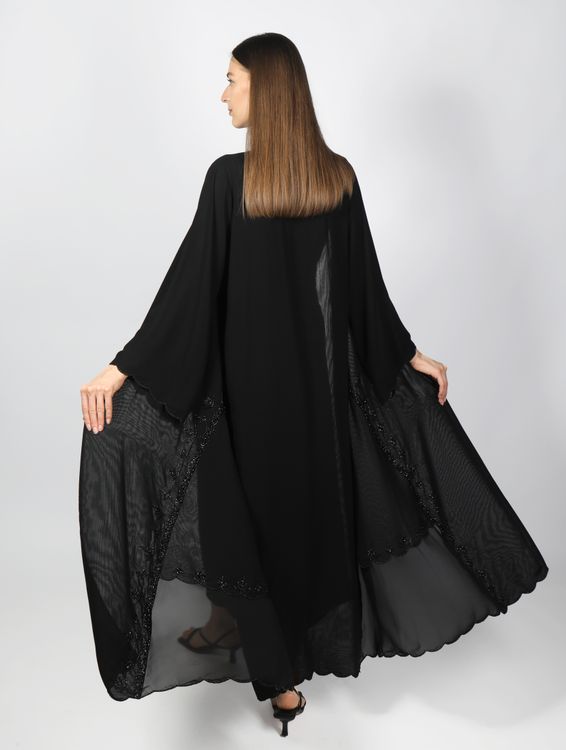 Back View of a Woman Wearing a Black Gown · Free Stock Photo