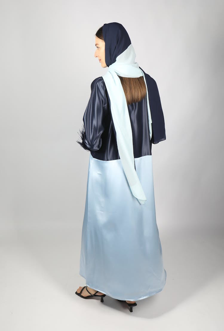 Back View Of A Woman Wearing A Silk Abaya