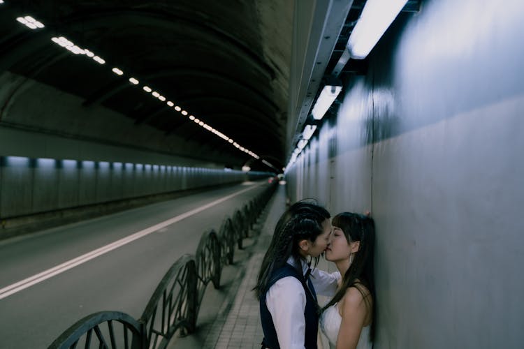 Two Women Kissing In A Tunnel 