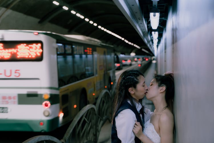 Women Couple In A Tunnel Kissing