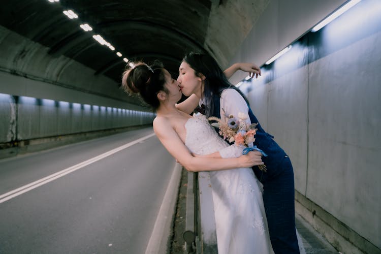 Women Kissing Inside A Tunnel