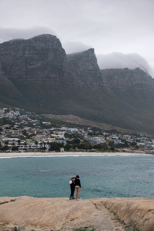 Couple by the Lake in a Mountain Valley 