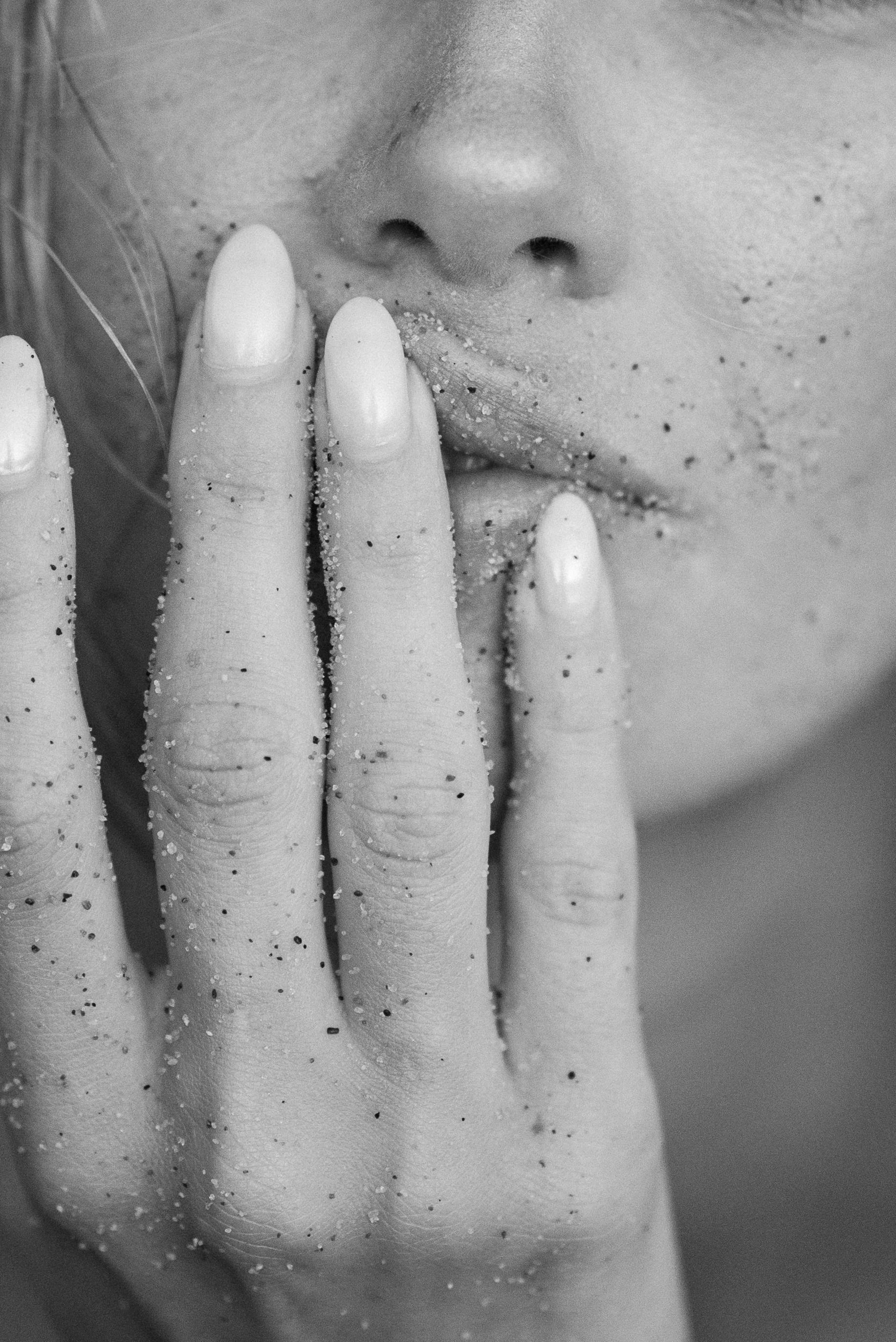 sand on hand and lips