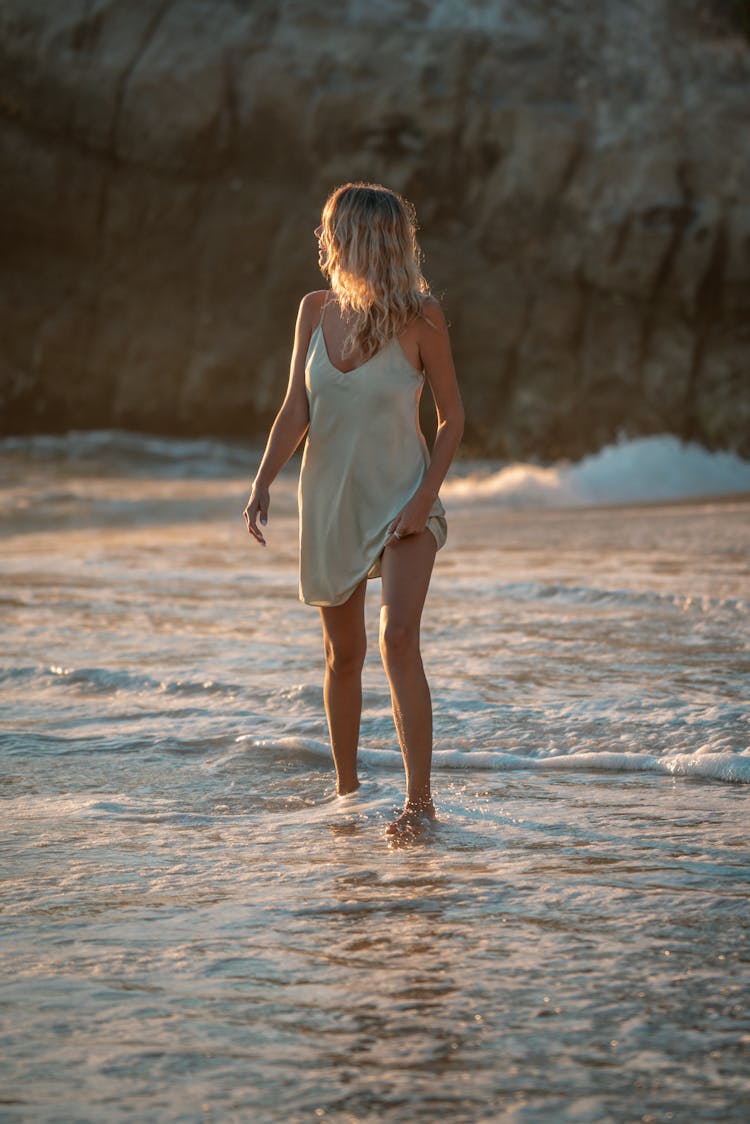 A Woman Walking On Shore