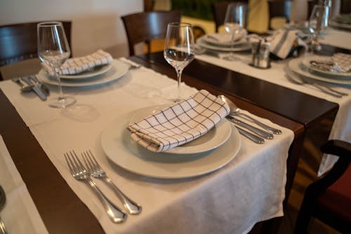 Free Table Setting with White Plates Stock Photo