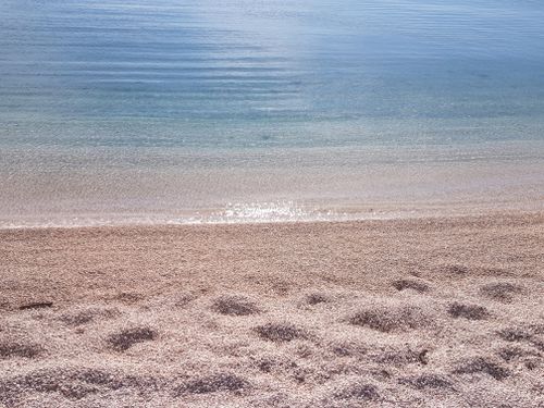 Free Tranquil view of sandy beach and calm sea waters in Split, Croatia. Stock Photo