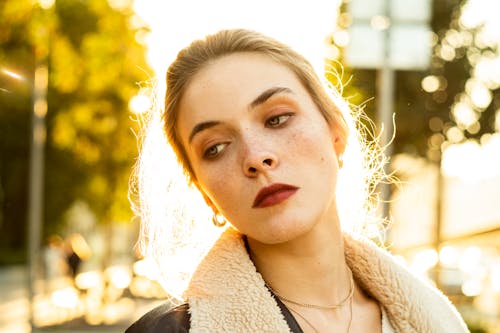 Beautiful Young Woman Wearing a Jacket Posing Outdoors 