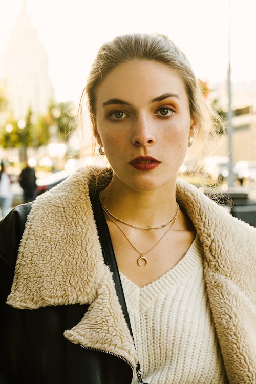 Beautiful Young Woman Wearing a Jacket Posing Outdoors 