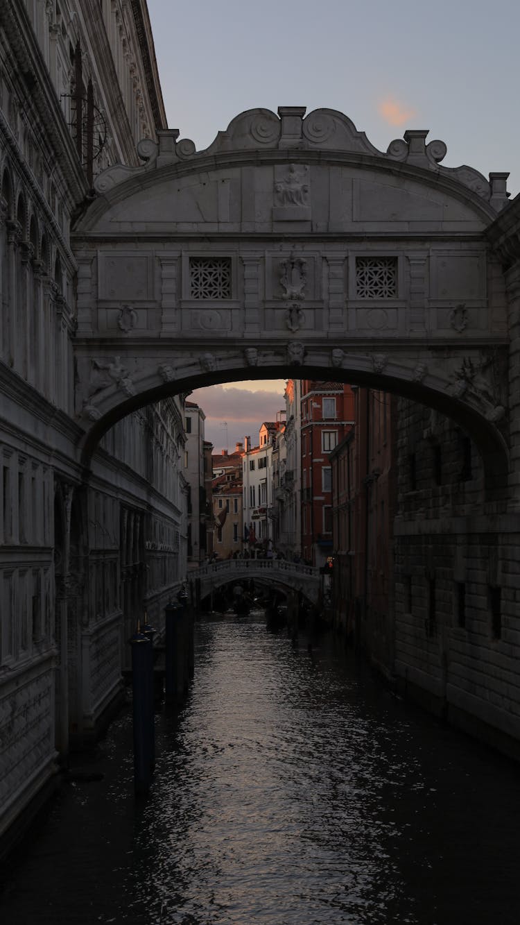 Bridge Connecting Buildings Above Canal