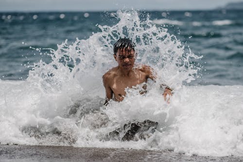 Boy Swimming on Sea