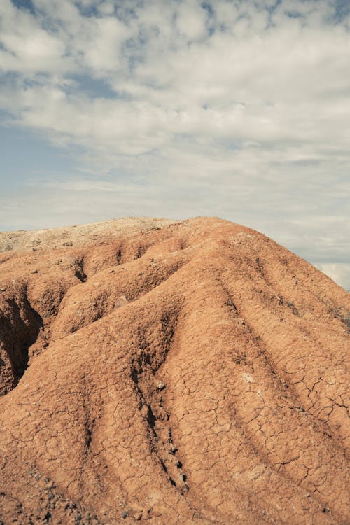 Arid Hill on Blue Sky Background