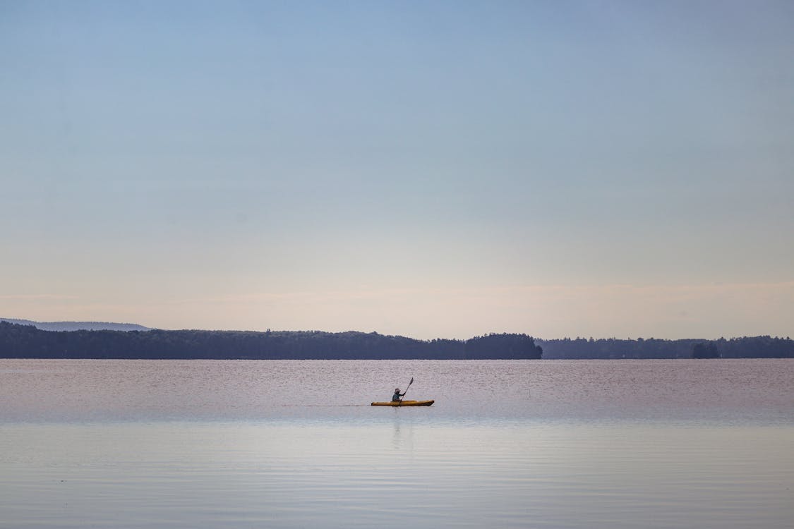 Person Kayaking at Dawn