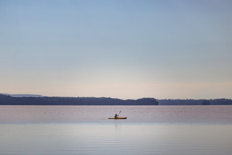 Person Kayaking At Dawn