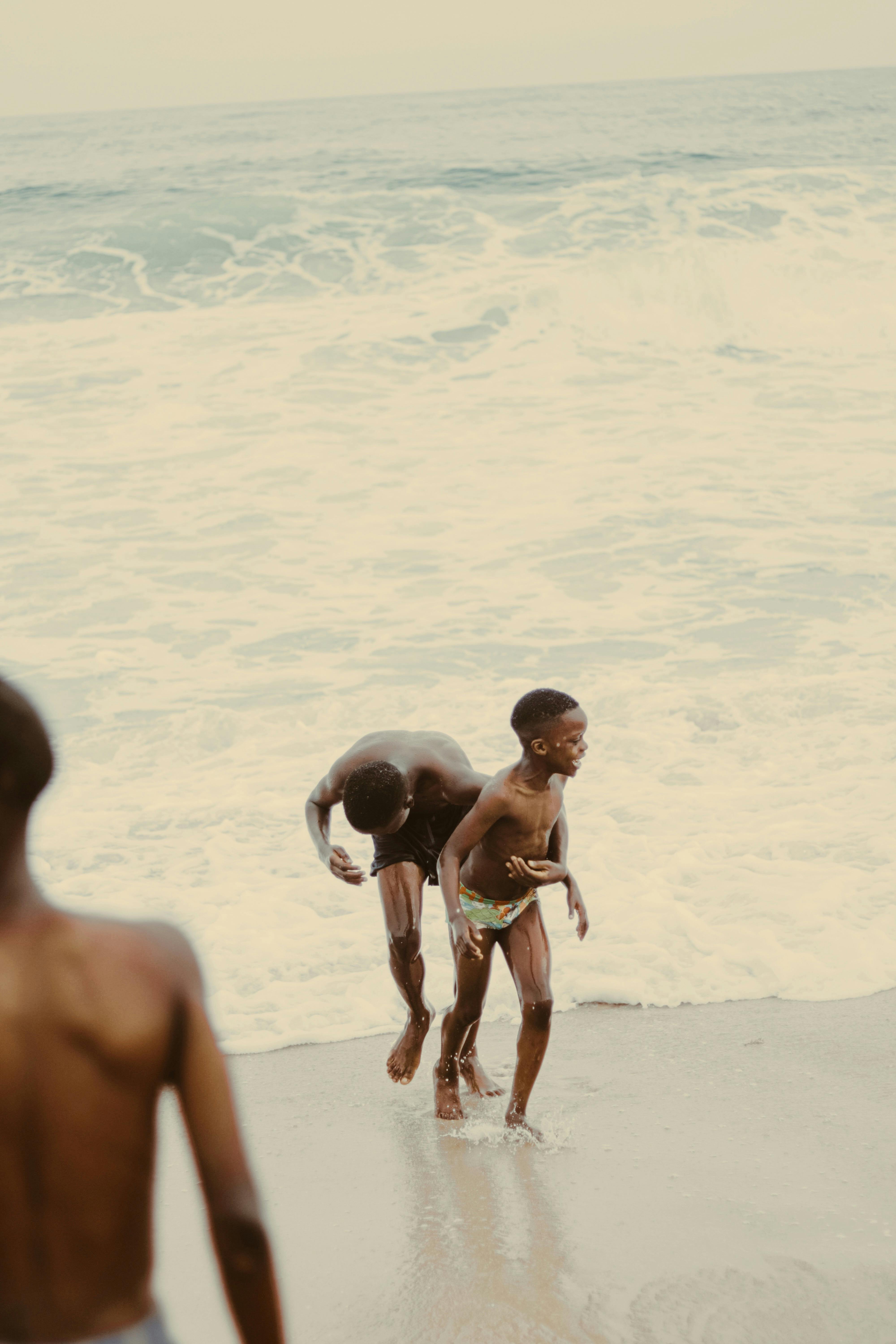 shirtless boys at the beach