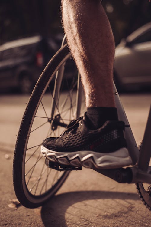 Leg of a Man Riding a Bicycle