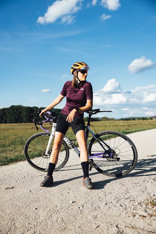 A Woman Posing with Road Bike