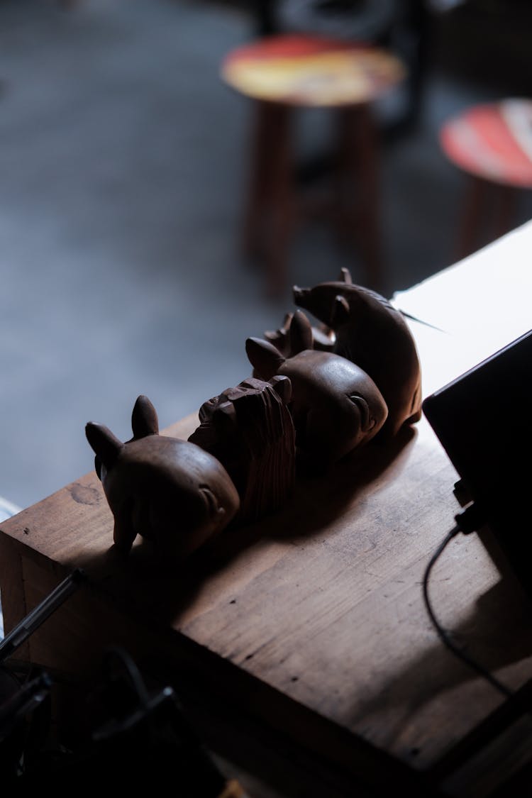 Wooden Carved Animals On A Wooden Table