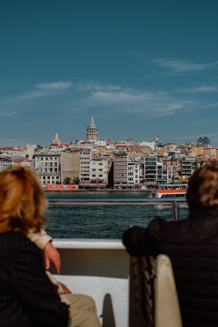 People Looking At The Cityscape Of Istanbul From Across The Strait 