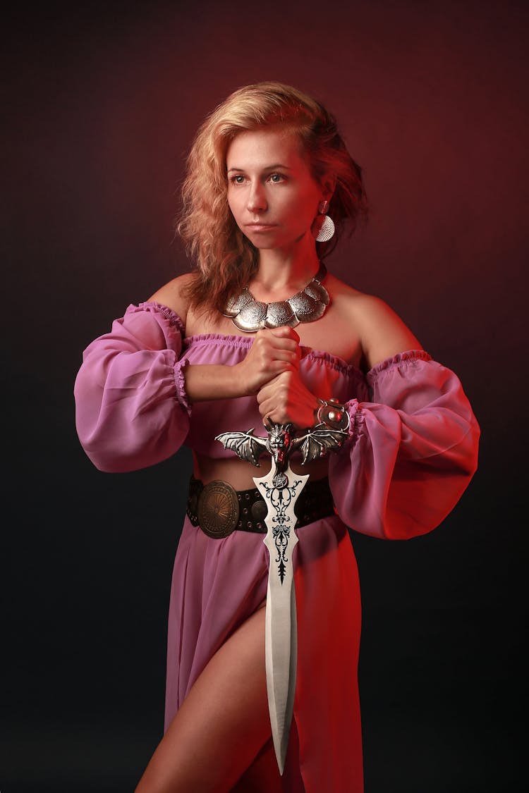 A Woman Holding A Sword 