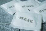 Close-up of Small Packets of Sugar