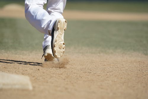 Close-up of Feet of a Man Walking on the Sand 