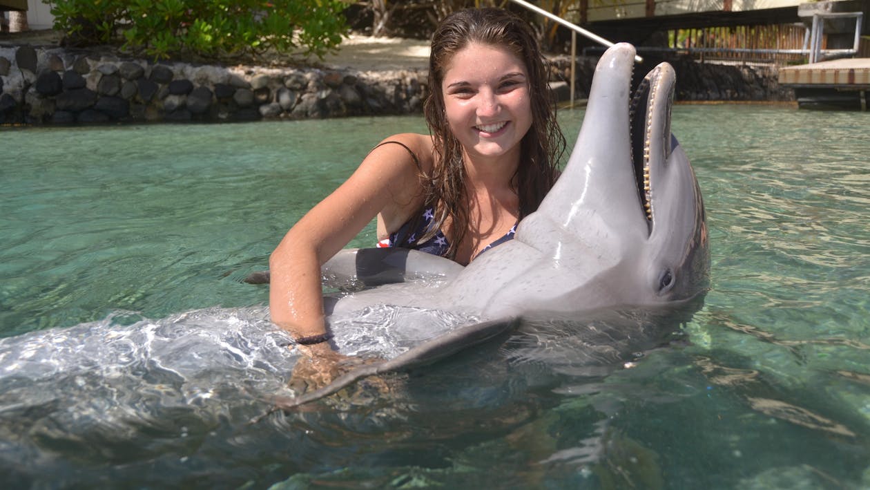 A woman with a dolphin