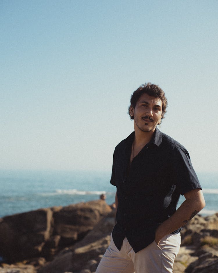 Man In Shirt On Sea Shore