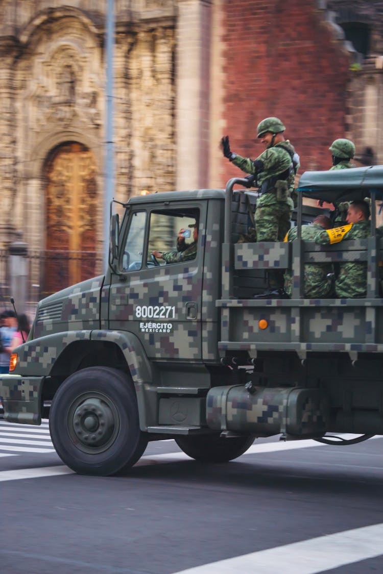 A Military Vehicle On A Road