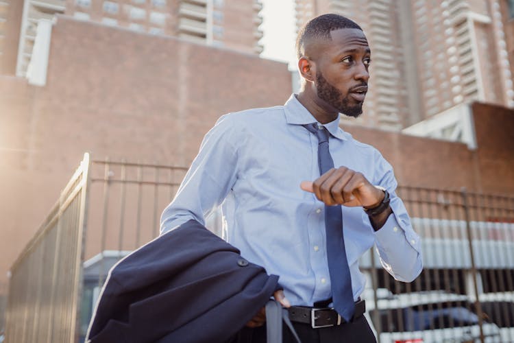 Businessman Checking Time Outdoors