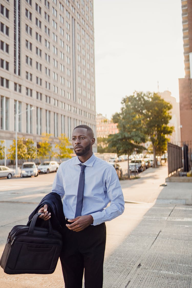 Businessman In Suit Walking Empty City Street