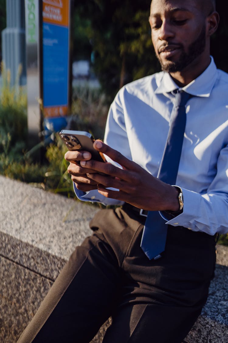 Businessman Using Modern Cellphone Outdoors