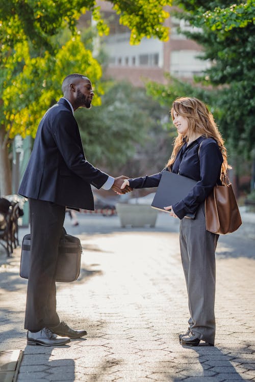 A Man and a Woman Shaking Hands