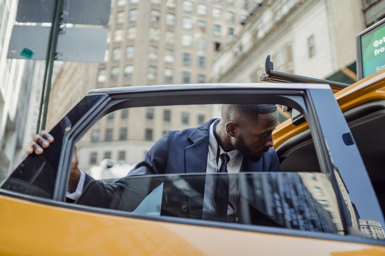 Man Getting Into A Car 