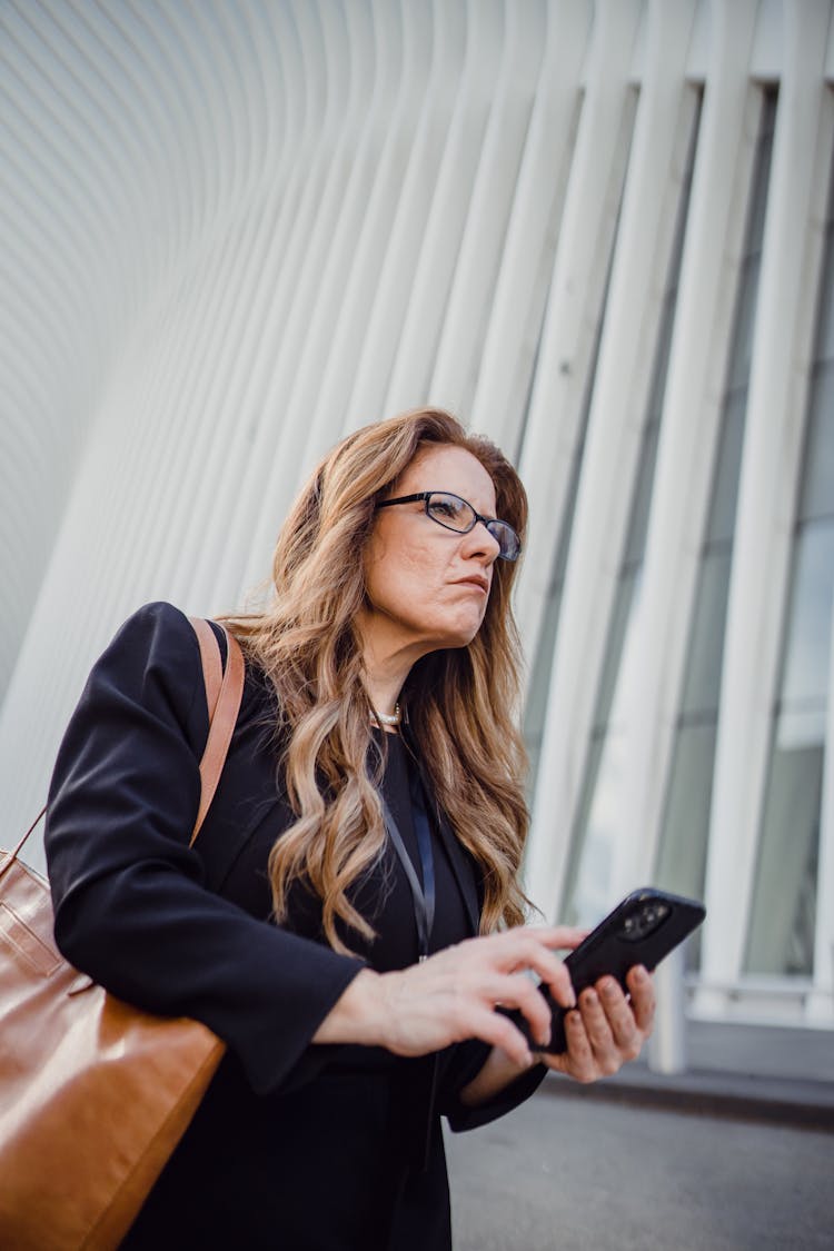 Frowning Woman Using A Smart Phone