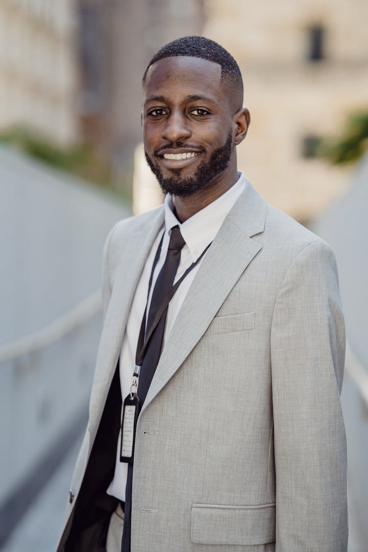 Smiling Man With A Beard In A Suit