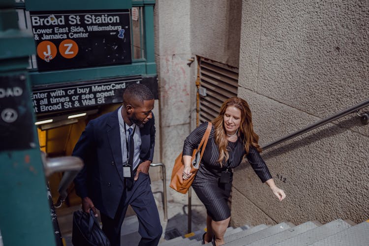 Man And Woman Walking From Metro Station