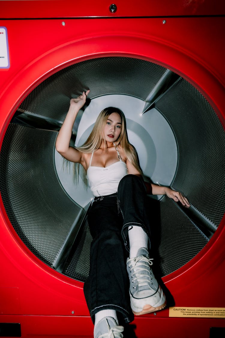 Girl Sitting In A Washing Machine Drum 