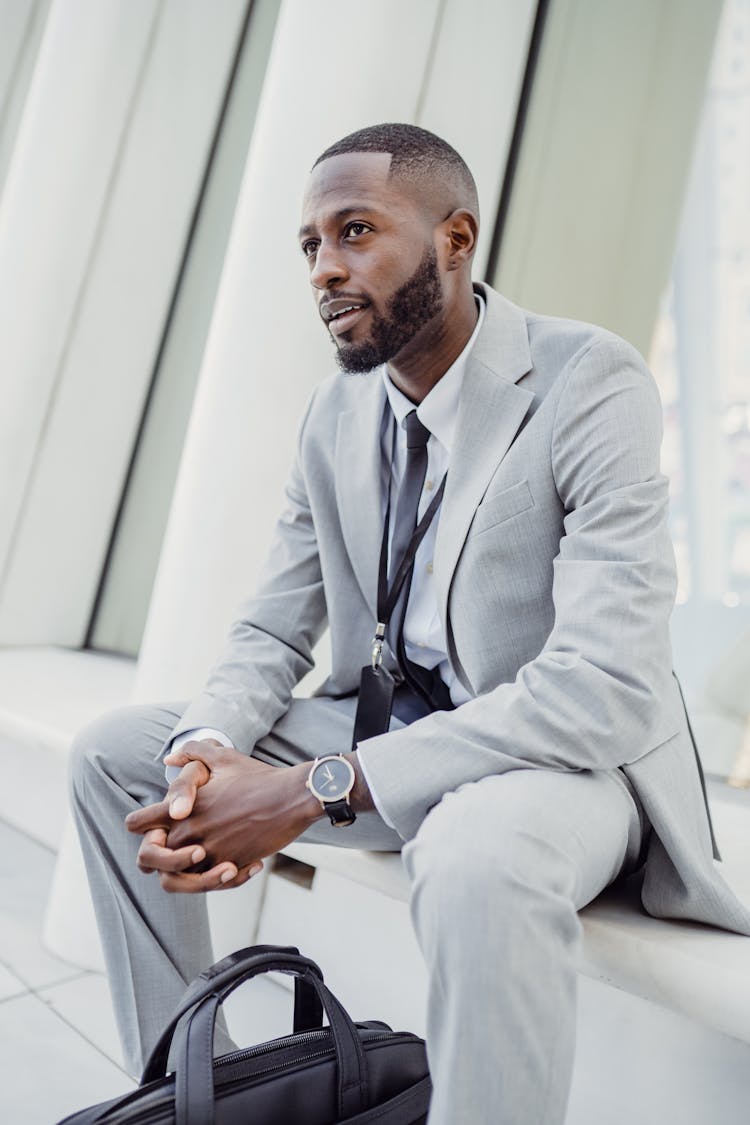 Man In Suit Sitting