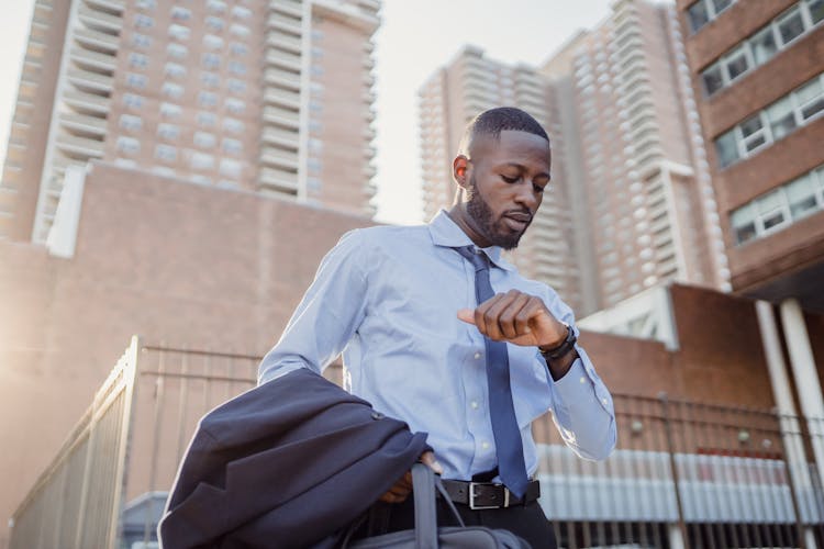 Man Looking At Watch