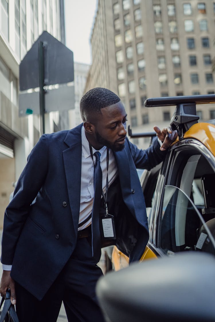 Man In Suit By Taxi