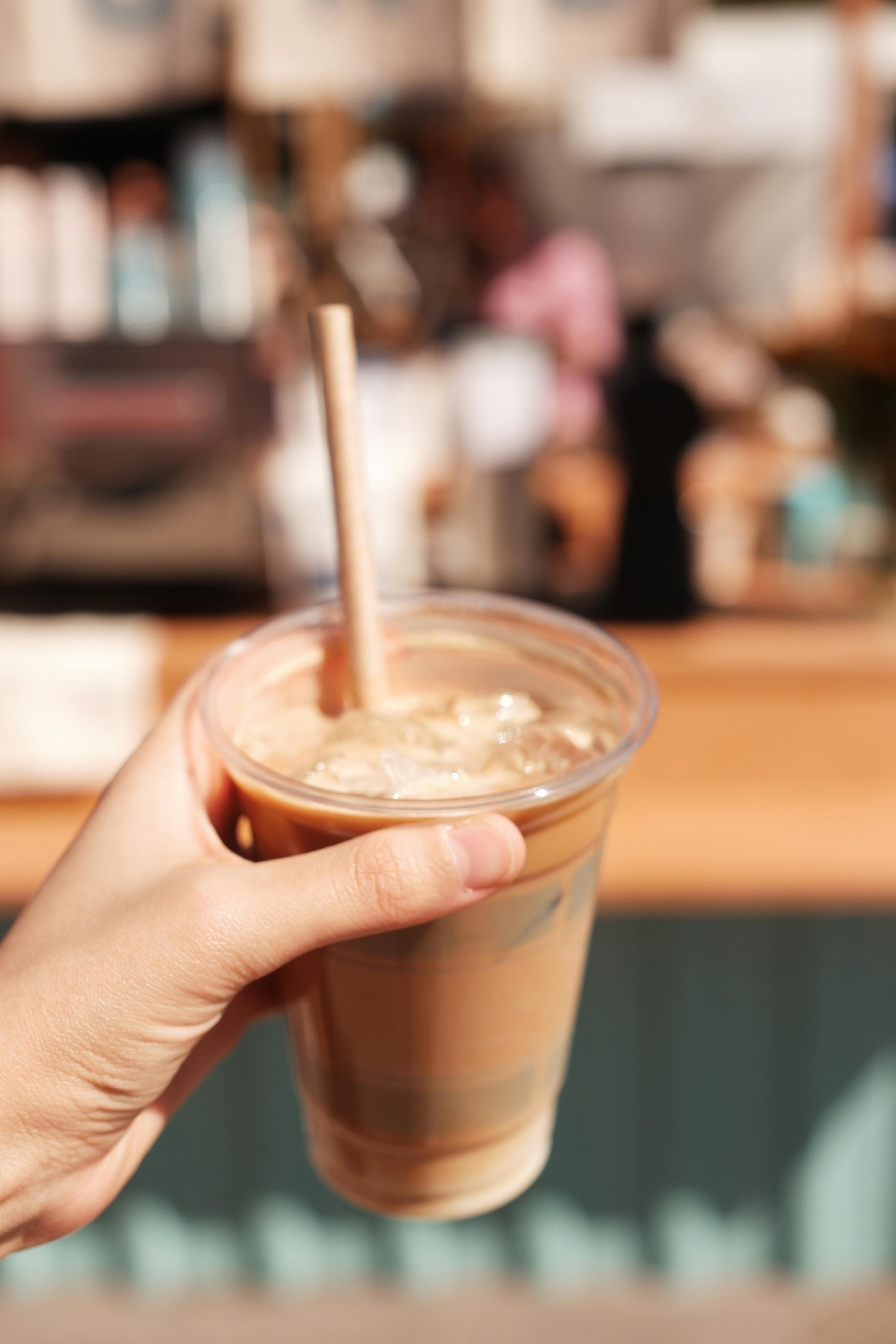 Glass Of Iced Latte With A Straw by Stocksy Contributor Anna