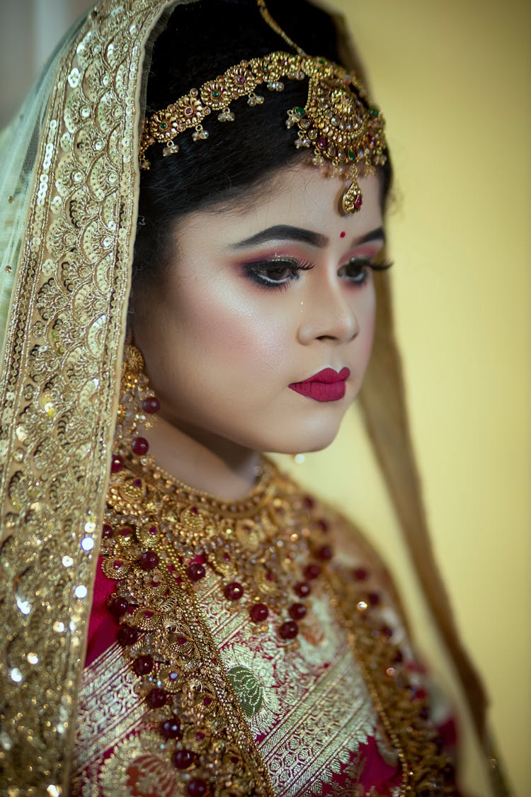 A Beautiful Bride Wearing Gold Veil 