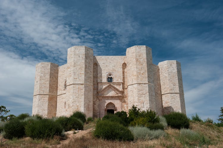 Facade Of The Castel Del Monte On A Hill In Andria, Apulia, Italy 